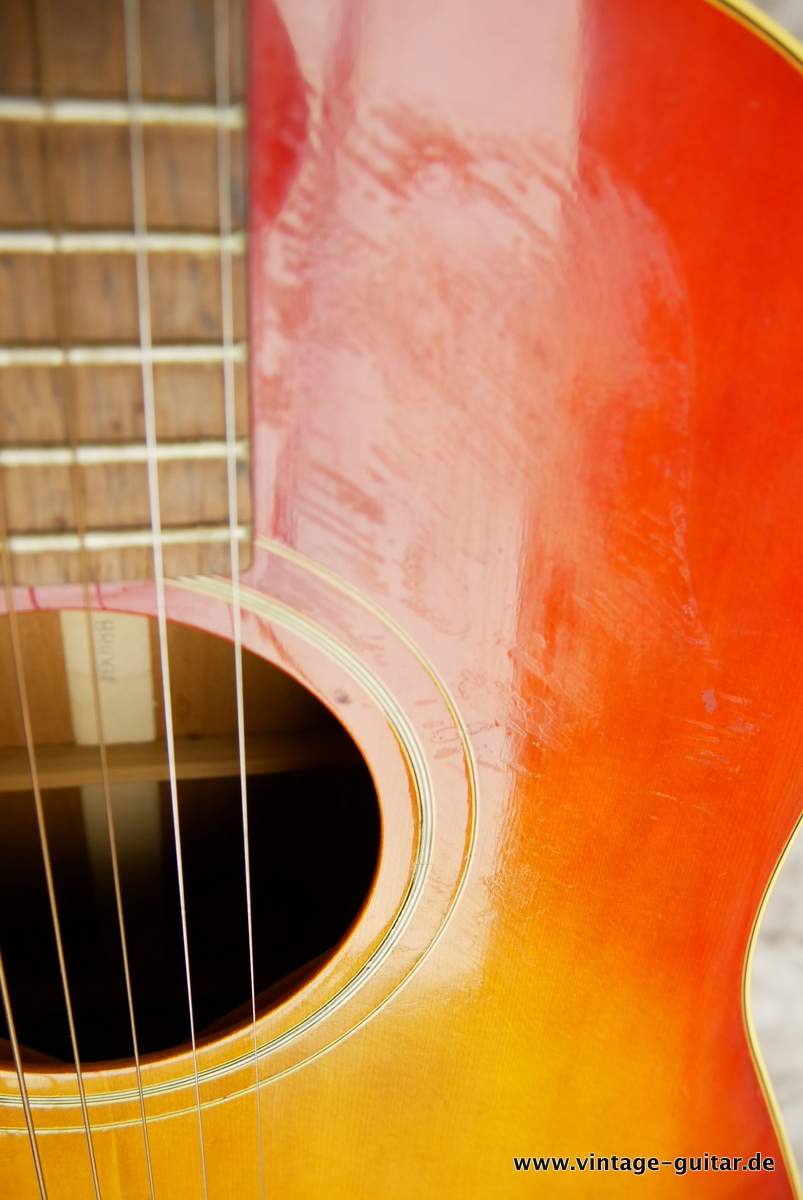 img/vintage/3678/Gibson_J_45_ADJ_Bridge_cherry_sunburst_1964-016.JPG